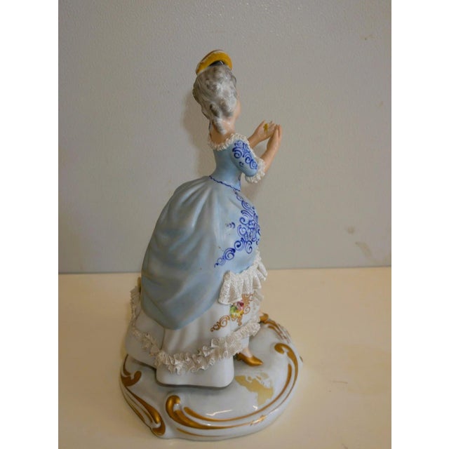 Vintage Capodimonte Porcelain Figurine Figurine depicting an 18th-century lady in porcelain. Colored and hand-gilded...
