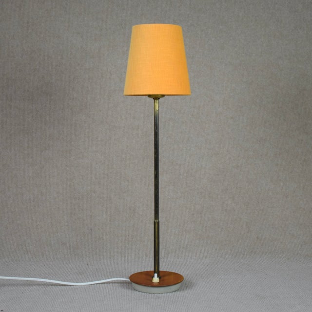 Table lamp by Bertil Brisborg for NK. Triva series. Model no. 532-007. Measure incl shade 56, ø 15. Base 12 cm ø. This...