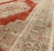 This beautiful classic Vintage Oushak has a large medallion in a beautiful soft red complemented by light green border and...