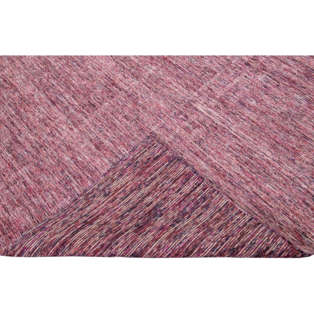 Beautiful Apadanas's handmade bamboo & silk Indian groove rug with the red field. This groove collection rug has an all-...