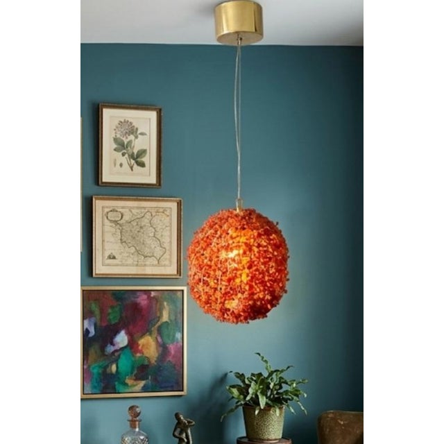 ​Bring a burst of rich texture and vibrant, retro energy to your next project with this striking pair of mid-century...