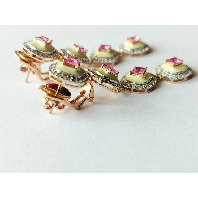 A very gorgeous and Modern Style Pink Sapphire Chandelier / Dangle Earrings set in 18K Gold & Diamonds. The weight of the...