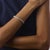 This elegant vintage diamond bangle bracelet is a timeless 1990’s design, featuring 64 round brilliant cut diamonds...