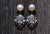 The Selby: Antique Retro Era Pearl and Diamond Danglers. The earrings feature pearl studs with dangling retro era white...