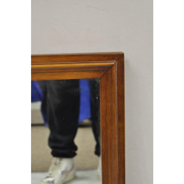 Vintage Mid Century Modern Walnut Wooden Frame 27" x 41" Modernist Wall Mirror. Item features a solid wood frame,...