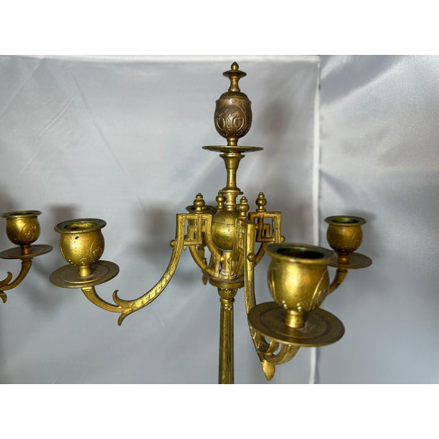 Pair of Aesthetic Movement Gold Gilt Candelabras for your consideration. Each candelabra measures approx. 19 1/2 inches...