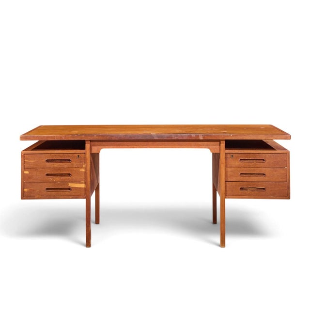 Peter Hvidt Style Mid Century Danish Teak Executive Desk This desk measures: 68.75 wide x 32.25 deep x 28.75 high, with a...