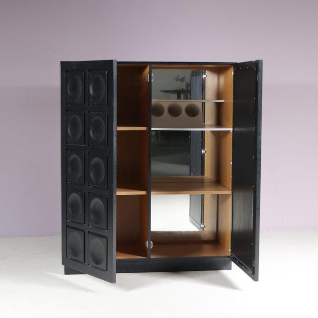 A beautiful black-stained brutalist bar cabinet in the style of De Coene, manufactured in Belgium in the 1970s. This...
