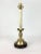 Beautiful candlestick table lamp with graceful lines.Bright Brass color and finished with gilt details.