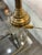 This elegant brass table lamp features a refined faux bamboo stem that evokes vintage designs from the '70s. The white...