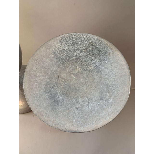 A true mid-century statement piece, these vintage Attributed to Arthur Court hourglass stools embody the sculptural...