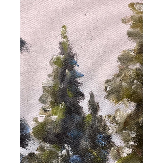 In "Light Warms the Cold," a serene winter landscape unfolds, where tall evergreens rise against soft, snow-covered...