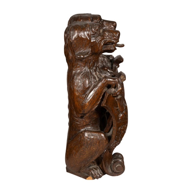 Carved Oak Figures Of Seated Dogs With Shields - a Pair | Chairish