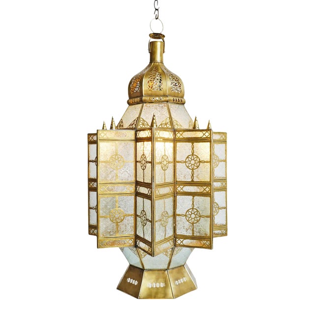 Vintage Moroccan brass and glass pendant lantern. Striking and intricate handmade piece with printed clear glass. Each may...