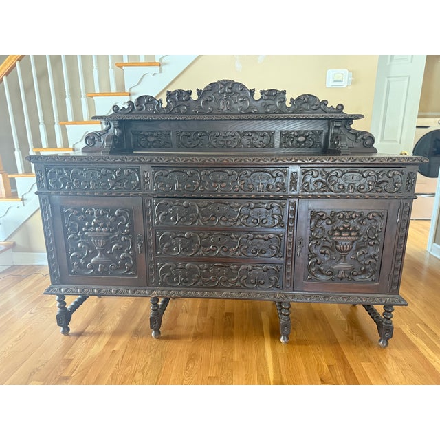 Spanish Renaissance Revival Oak Sideboard, early 1900's, fully carved in scrolling foliates throughout, having top shelf,...
