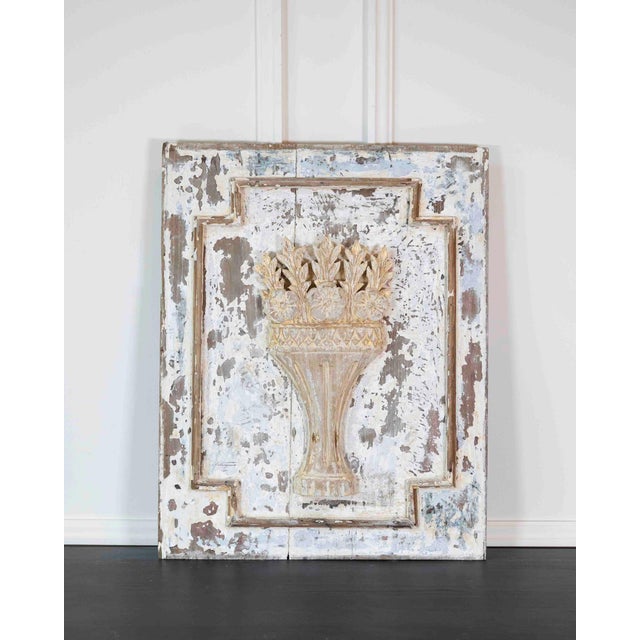 Decorative 18th century carved wooden panel featuring beautifully executed hand-carved ornamentation within a painted...