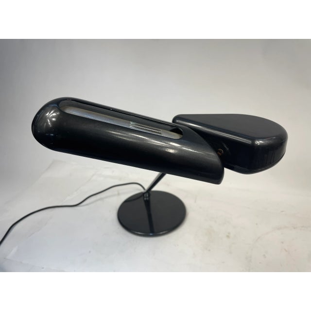 Made in Italy table lamp, designed by Bruno Gecchelin for Arteluce in 1979. Adjustable to various angles. This piece has...