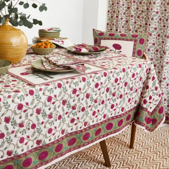 The Gina design draws upon Mughal influences, featuring a floral vine pattern in magenta pink on cream. A stately border...
