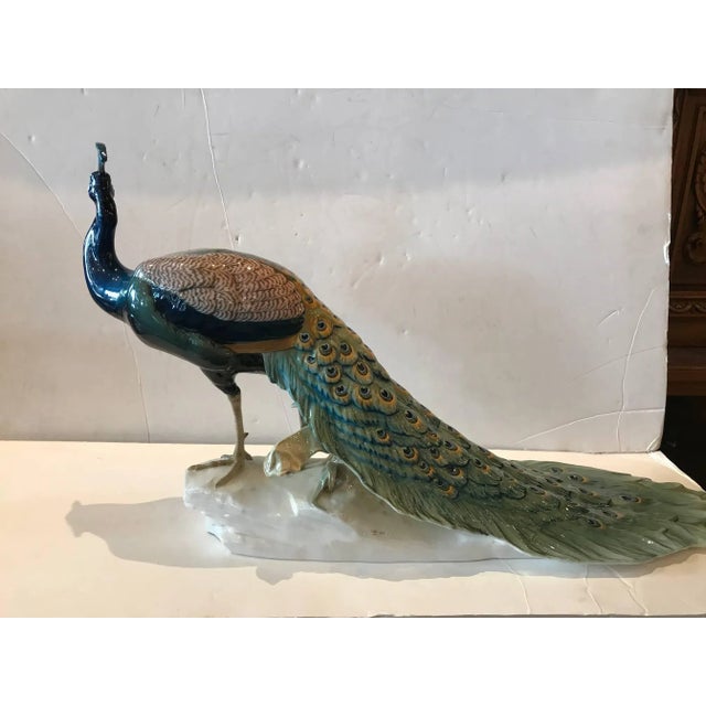 Breathtaking porcelain peacock by Nymphenburg, the sculptor Theodor Ka¨rner created in 1906. This model was is signed and...