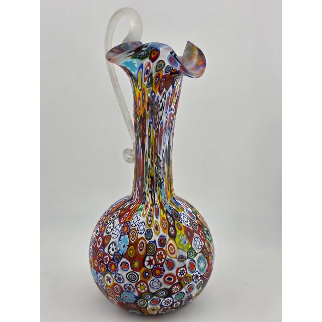 This vintage Fratelli Toso Murano Millefiori art glass vase pitcher is a colorful and whimsical piece of decorative...