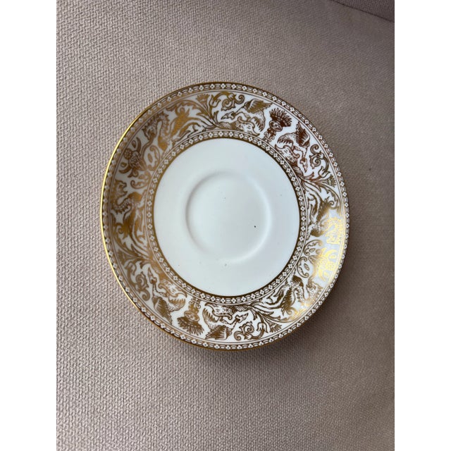 Wedgewood bone china Luncheon small bread plates. Gold Forentine pattern. Has gold dragons on rim against bone white ....