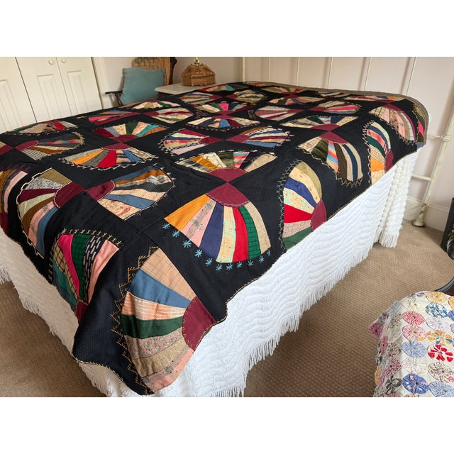 What an amazing crazy quilt! This is a very special quilt in fantastic condition. The colorful fans are set against a...