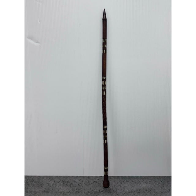 Design Plus Gallery presents Handcrafted Walking Stick from Afghanistan. Made from a dark, sturdy wood, embellished with...