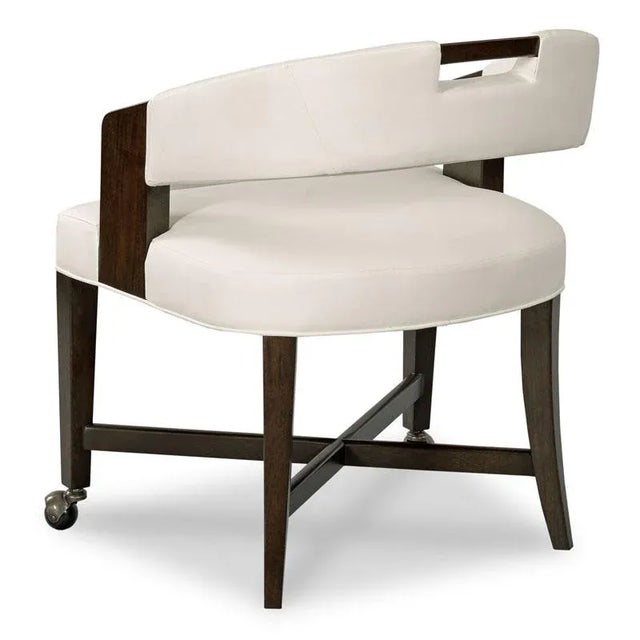 A curved upholstered top rail is fitted with a convenient handle resting above an upholstered seat raised by squared...