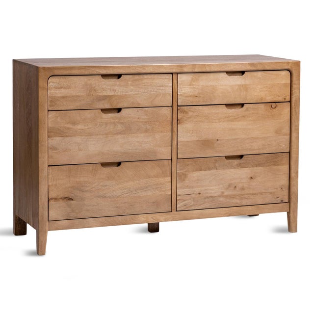 Solid mango wood six-drawer dresser with softened edges, seamless joinery, and integrated pull details. The warm natural...