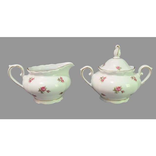 This beautiful creamer and sugar set from Bavaria, Germany is a true vintage gem. The fine porcelain material is adorned...