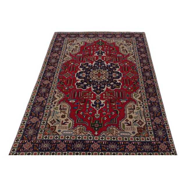 Hand knotted in wool, a vintage 4x7 Persian Tabriz rug originating circa 1970-1980 - making its way to our reputed Antique...