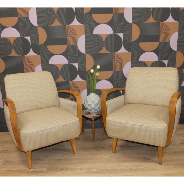 Charmingly rounded shapes with delicate yet sturdy legs, beautifully curved beechwood armrests, timelessly upholstered in...