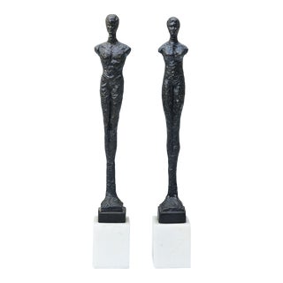 Manner of Alberto Giacometti, Pair of Bronze Figures on Alabaster Bases, 1970 For Sale