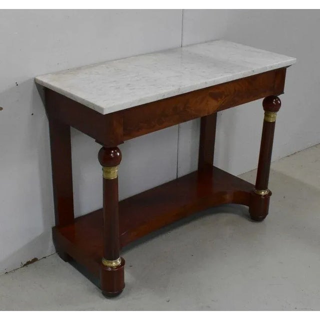 Console Mahogany plated with top Rectangular White Marble veined Gray, 2.5 cm thick. It has a belt plated drawer Figured...