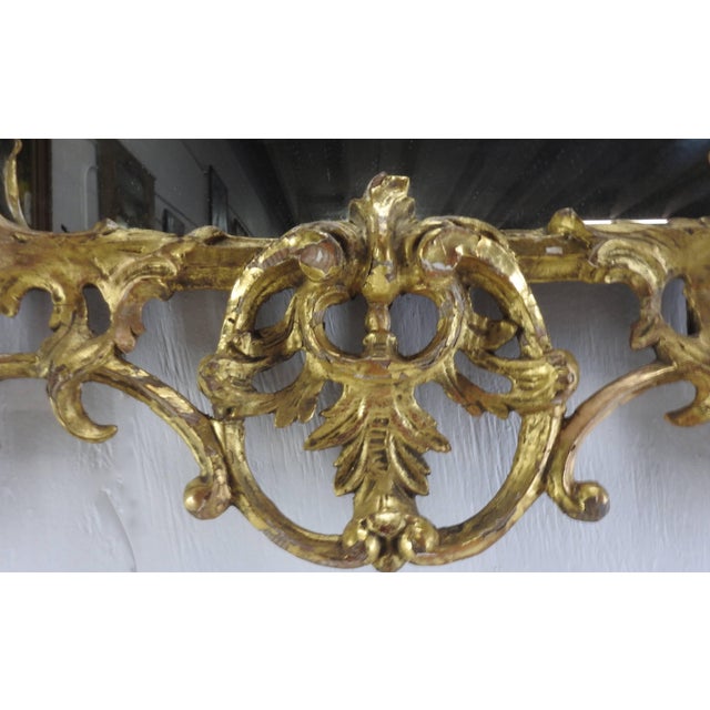 We are featuring an elaborate pair of George III bright gilt mirrors. Beautiful vines intertwine and connect to the...