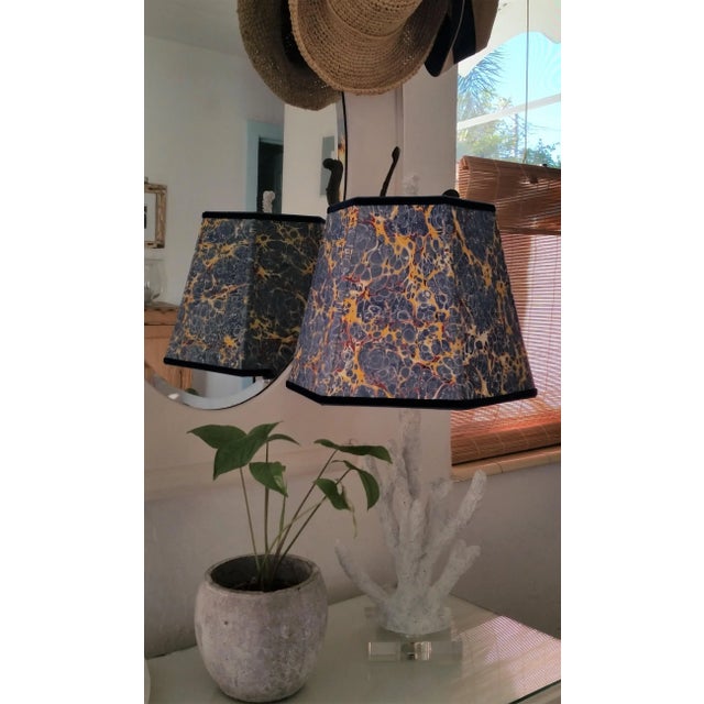 Paper and Trim Polystyrene lined Payhembury marbled paper. Royal blue, golden yellow, and red. Top and bottom wiring is...