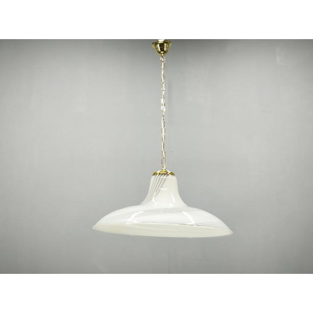 Large italian murano glass pendant light dating from the 1970s, distinguished by its sculptural profile and elegant...