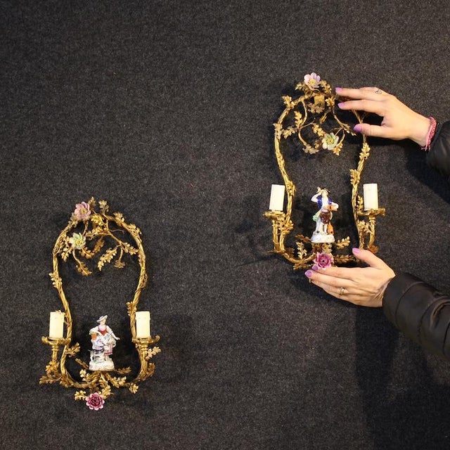 A pair of German wall lights from the early 20th century. Beautifully sized and decorated in bronze, brass, enameled...