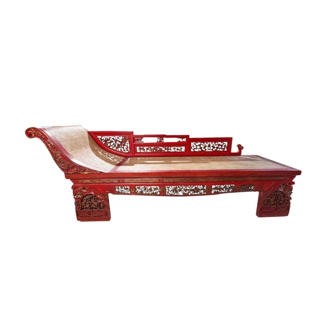 An exquisite vintage Chinoiserie daybed showcasing masterful hand-carved craftsmanship. This versatile piece functions as...
