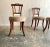 Petite yet comfortable set of four dining or side chairs in wonderfully patinated mahogany with original brass handles....
