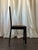 This set of four black-painted cane chairs features graceful arched backs and woven cane panels that bring a classic...