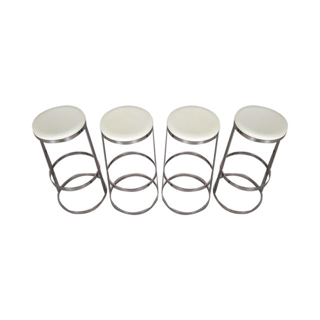 A beautiful set of four mid-century modern Aro swivel bar stools by Lievore Altherr Molina for Bernhardt Design. Offers...