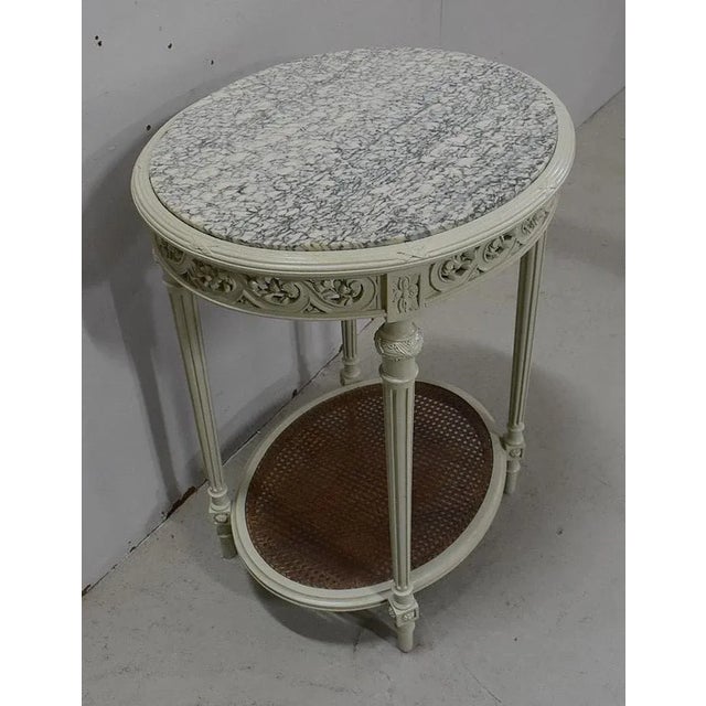 Pedestal Oval Wooden structure with rechampi cream color.Its top is a white marble veining at Green Tender, skilfully...