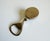 This vintage silver-finish bottle opener from the 1960s features a golf ball-shaped design that combines functionality...