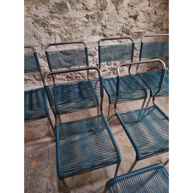 This set of six French spaghetti chairs, accompanied by a matching stool, dates from the mid to late 20th century and...