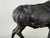 This is a large vintage sculpture of a stag. This cast-iron sculpture has a patinated bronze to the surface with a natural...