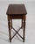 A 19th century French side table featuring a rectangular top supported by a simple wooden frame with stretcher detail. The...