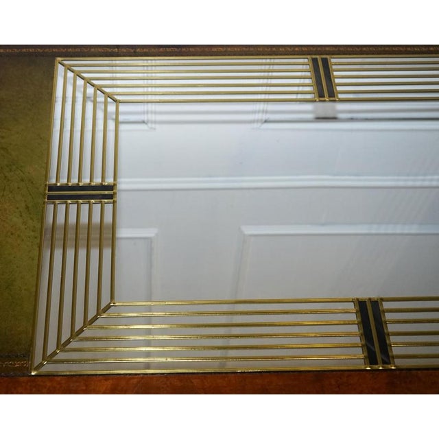 Decorative Art Deco Style Wall Mirror. Crafted by Lawson Glassworks, it is a stunning statement piece that captures the...