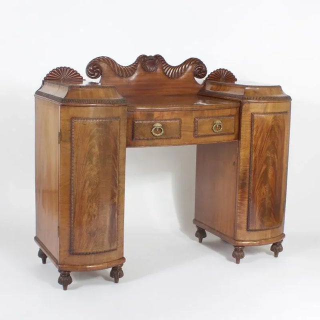 A rare small size antique English mahogany server or sideboard, William IV in style, with an uncommon form, beautiful...