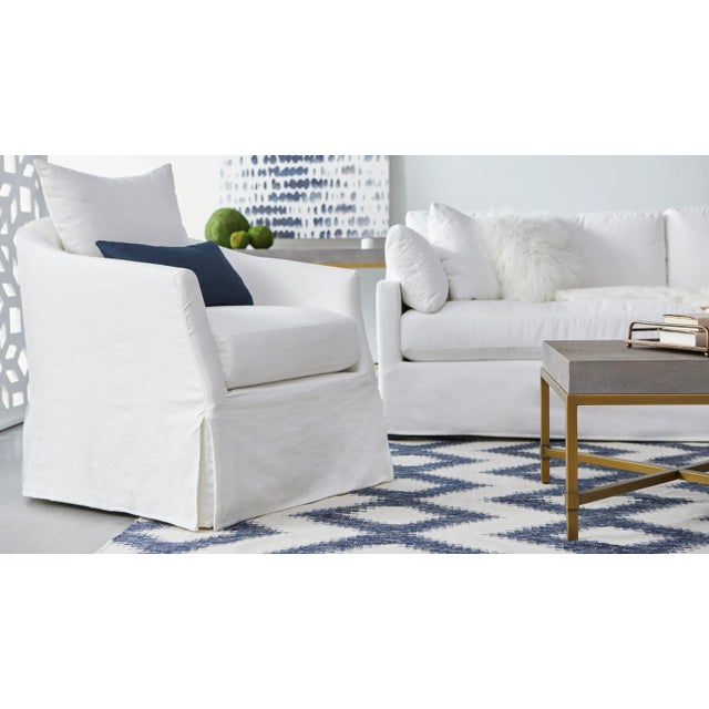 Add transitional style to your living room, family room, or den with this slipcover swivel club chair. With the seat...